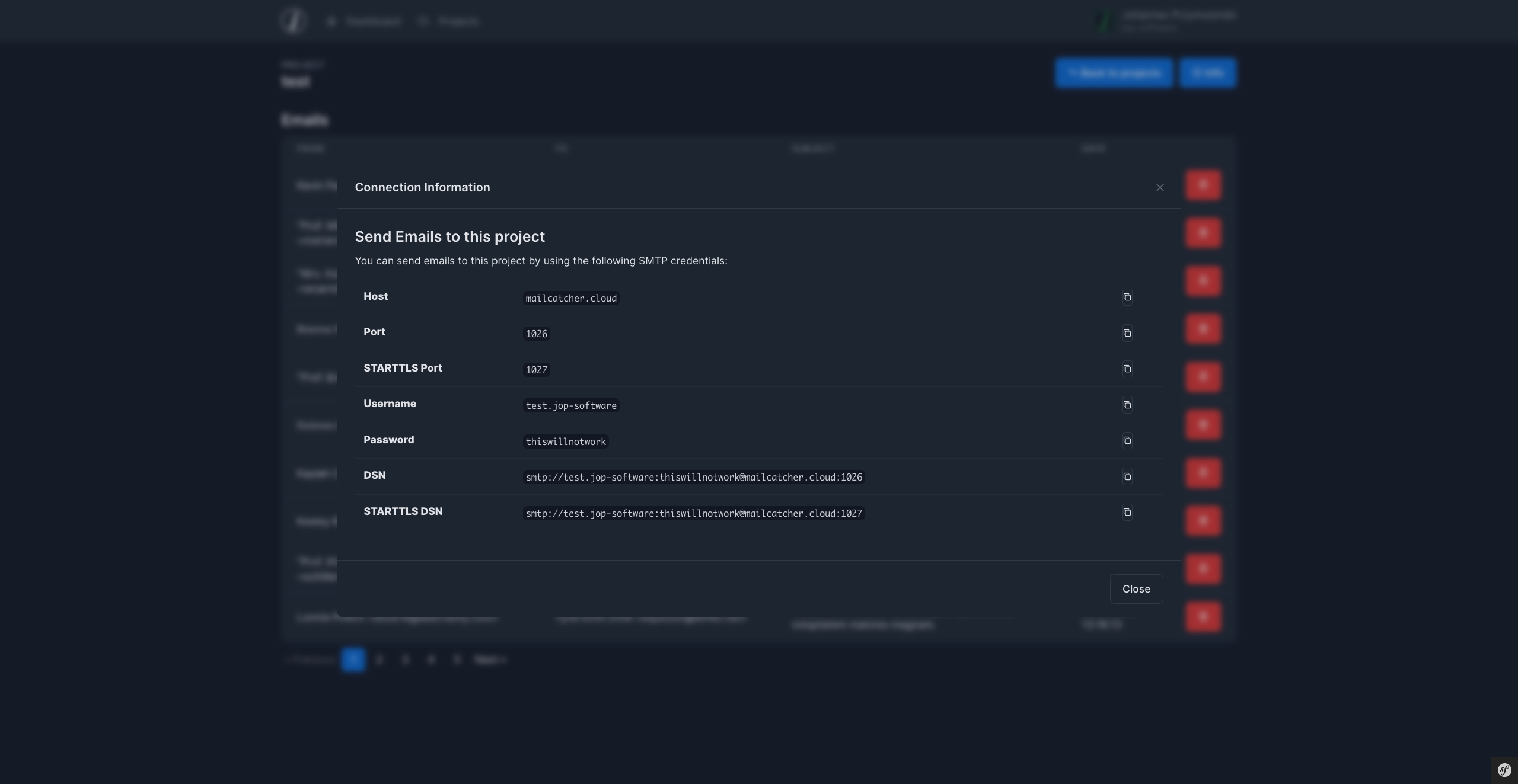 Modal showing Host, Port, STARTTLS Port, Username, Password and a DSN to connect to Mailcatcher